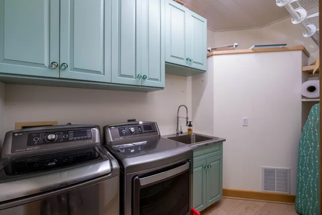 a bathroom with a toilet a sink and shower
