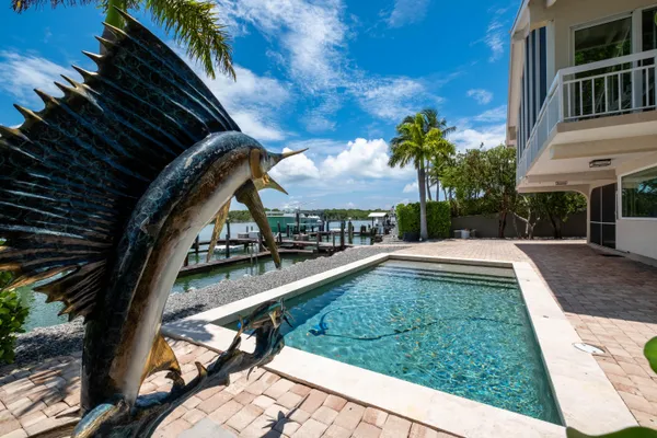 a kitchen with wooden floor and a stove top oven