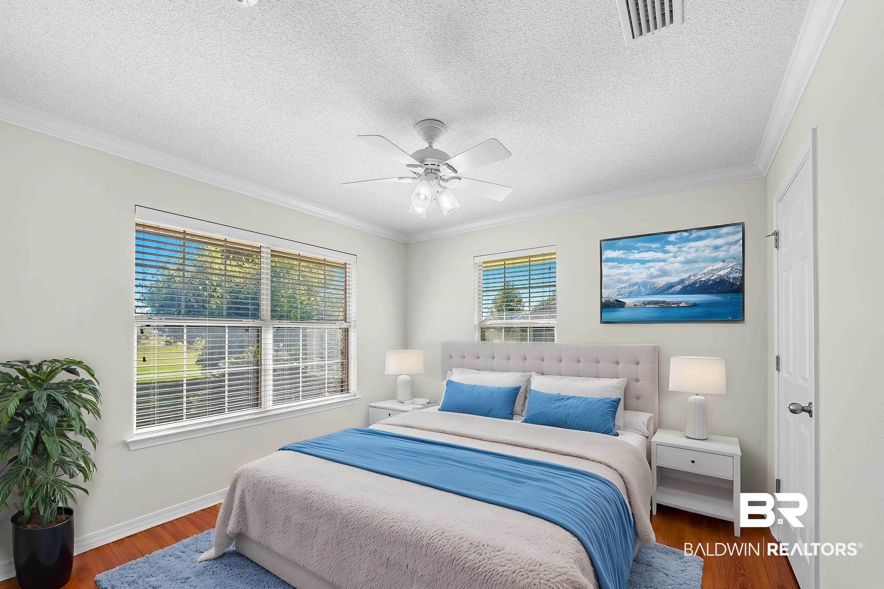 421 Collinwood Loop Foley, AL 36535 - Photo 61 of 62 Bedroom with dark wood-type flooring, a textured ceiling, ceiling fan, and ornamental molding