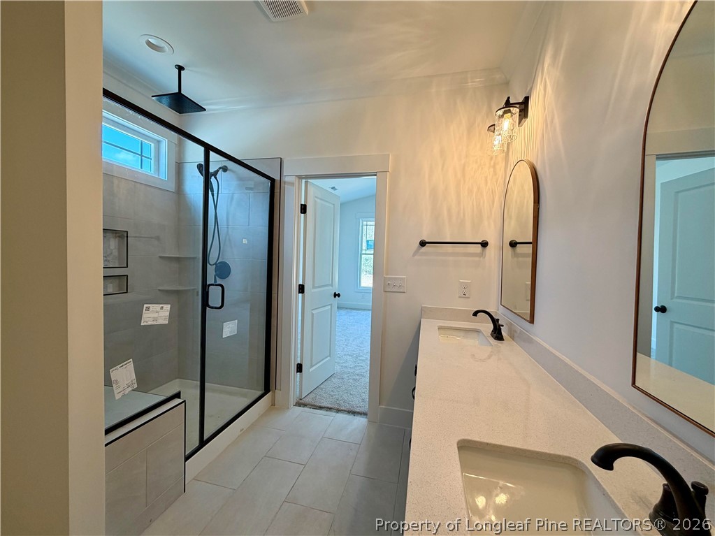 1788 Alderman Mill Road Dunn, NC 28334 - Photo 8 of 14 a bathroom with a shower and a sink