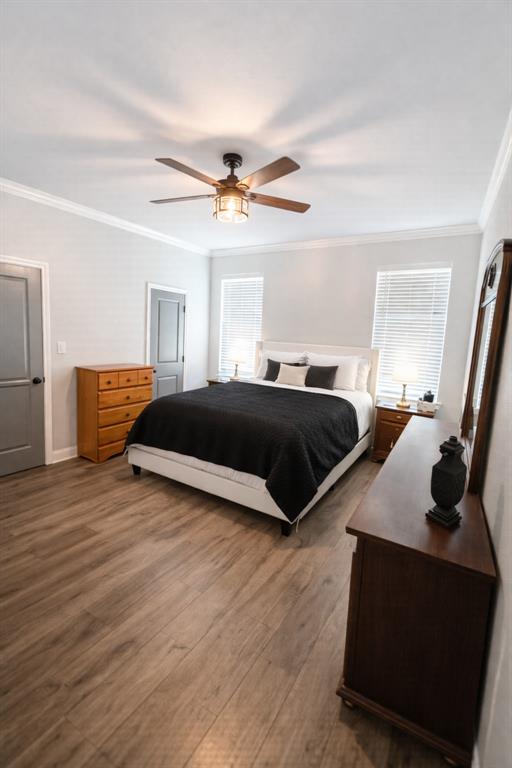 224 Fox Run Lane Robinson, TX 76706 - Photo 19 of 24 a bedroom with a bed and wooden floor
