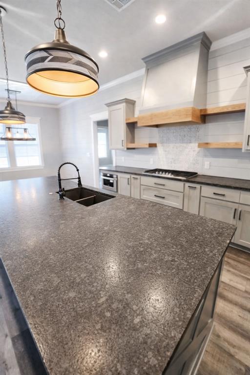 224 Fox Run Lane Robinson, TX 76706 - Photo 6 of 24 a kitchen with stainless steel appliances granite countertop a sink a stove and a wooden cabinets