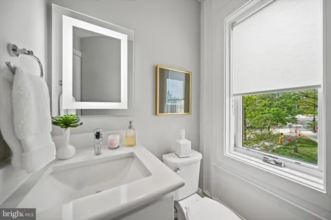 a bathroom with a sink toilet and tub