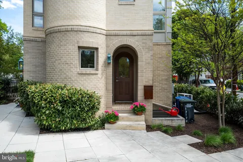 a view of a house with a flower garden