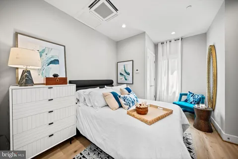a bedroom with a bed and a dresser