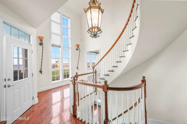 a view of an entryway with wooden floor