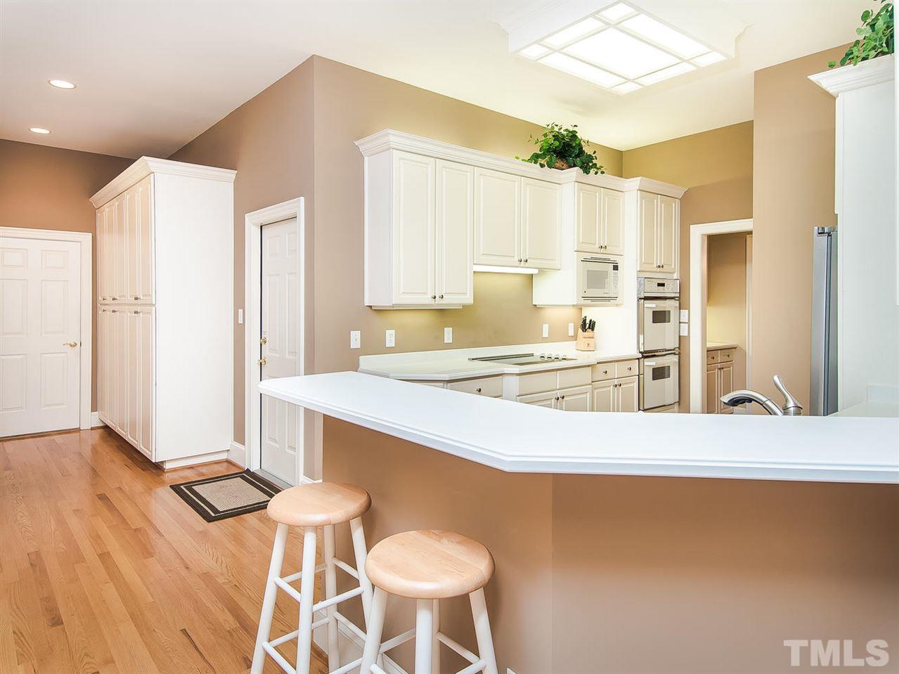 1108 Wagon Ridge Road Raleigh, NC 27614 - Photo 13 of 25 a kitchen with a sink cabinets and wooden floor