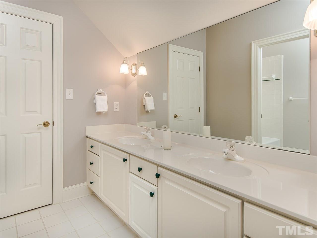 1108 Wagon Ridge Road Raleigh, NC 27614 - Photo 17 of 25 a bathroom with a granite countertop sink and a mirror
