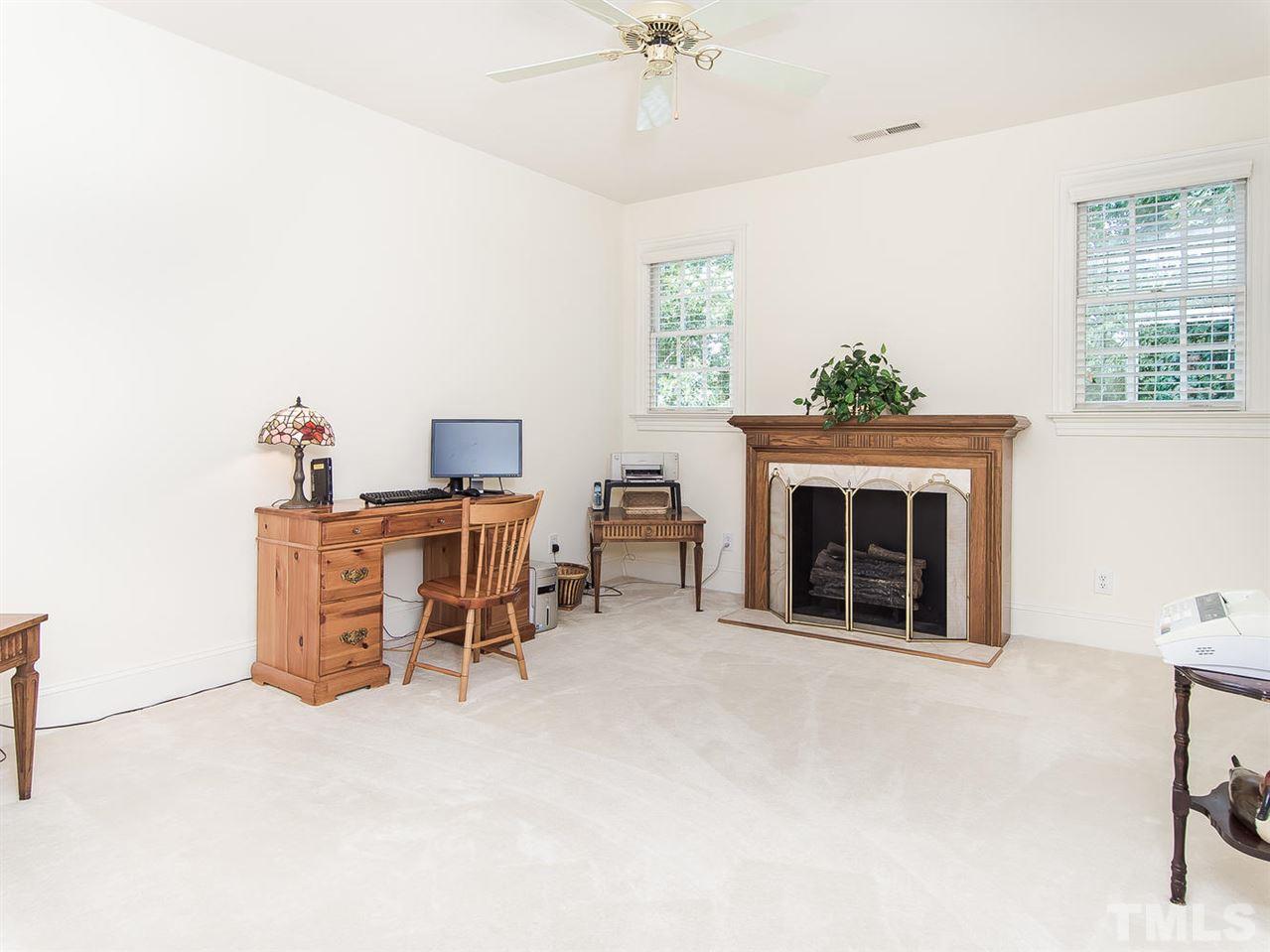 1108 Wagon Ridge Road Raleigh, NC 27614 - Photo 20 of 25 a dining room with furniture and a fireplace