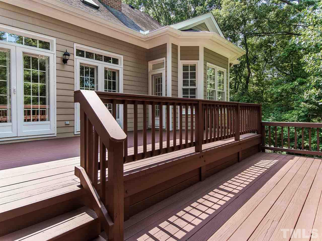 1108 Wagon Ridge Road Raleigh, NC 27614 - Photo 23 of 25 a view of a wooden deck with a yard