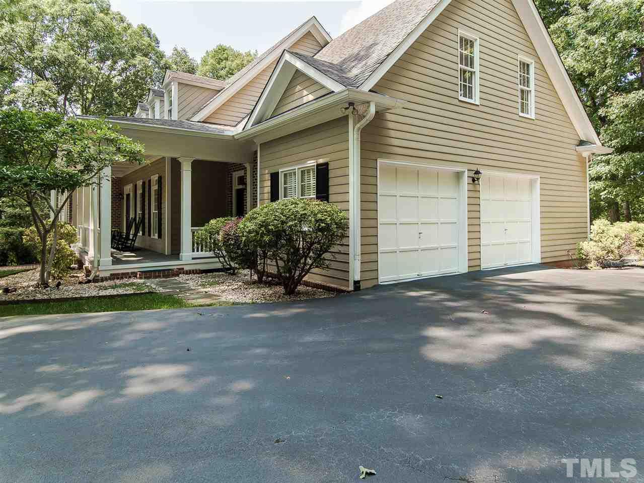 1108 Wagon Ridge Road Raleigh, NC 27614 - Photo 25 of 25 a view of a white house with a large windows