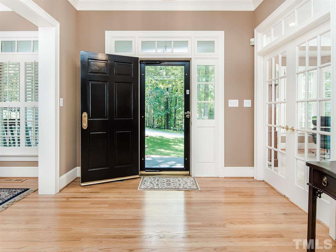 1108 Wagon Ridge Road Raleigh, NC 27614 - Photo 4 of 25 a view of a door with wooden floor and a yard