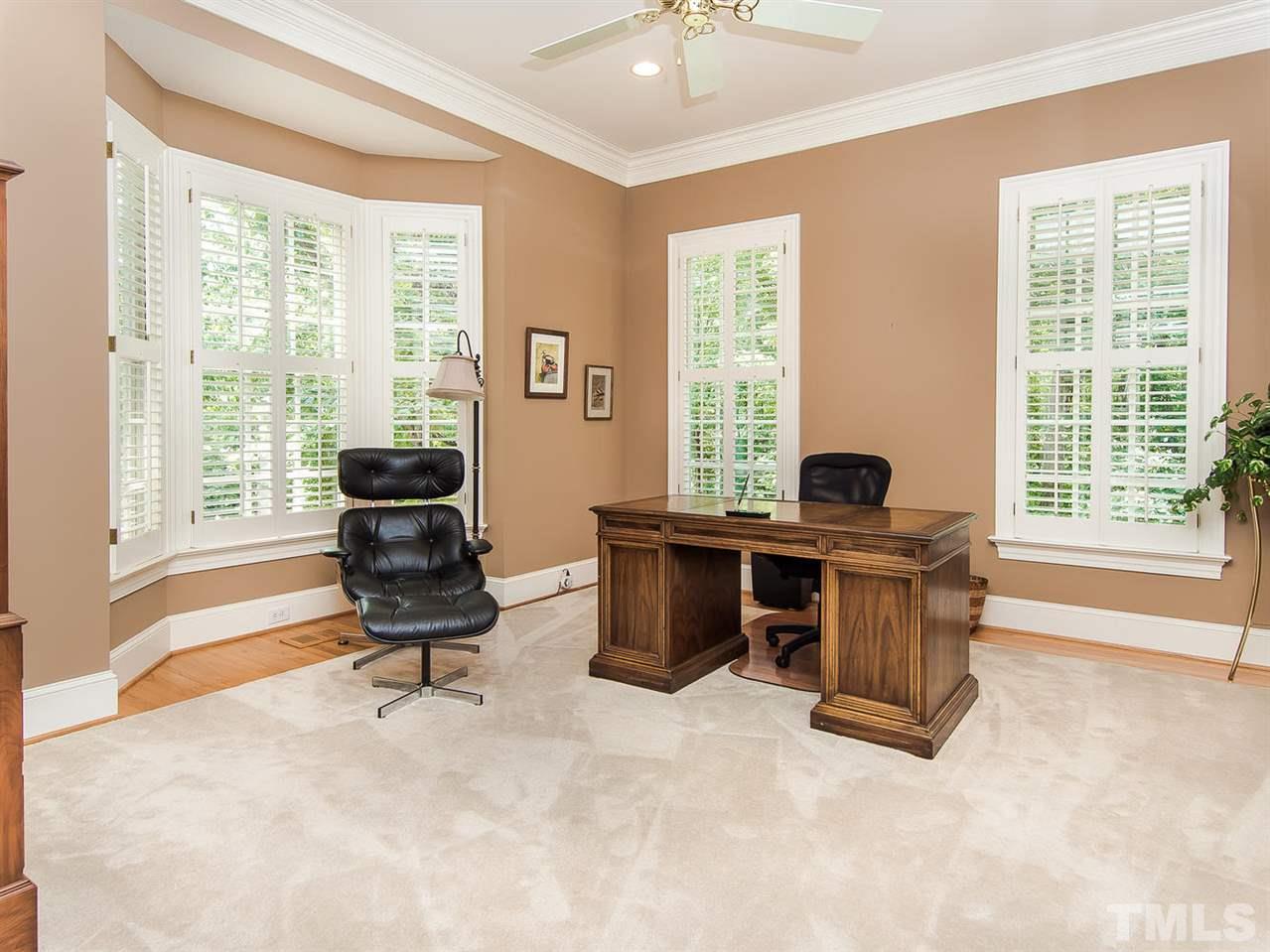 1108 Wagon Ridge Road Raleigh, NC 27614 - Photo 5 of 25 a view of a workspace with furniture and a window