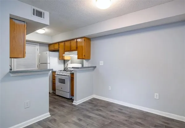 a kitchen with a sink and a stove top oven