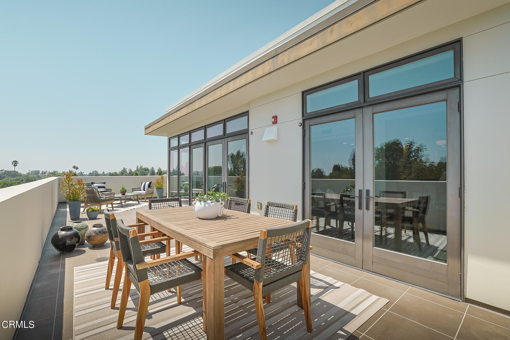920 Granite Drive, Unit 509 Pasadena, CA 91101 - Photo 1 of 24 a view of a dining hall with furniture and floor to ceiling window