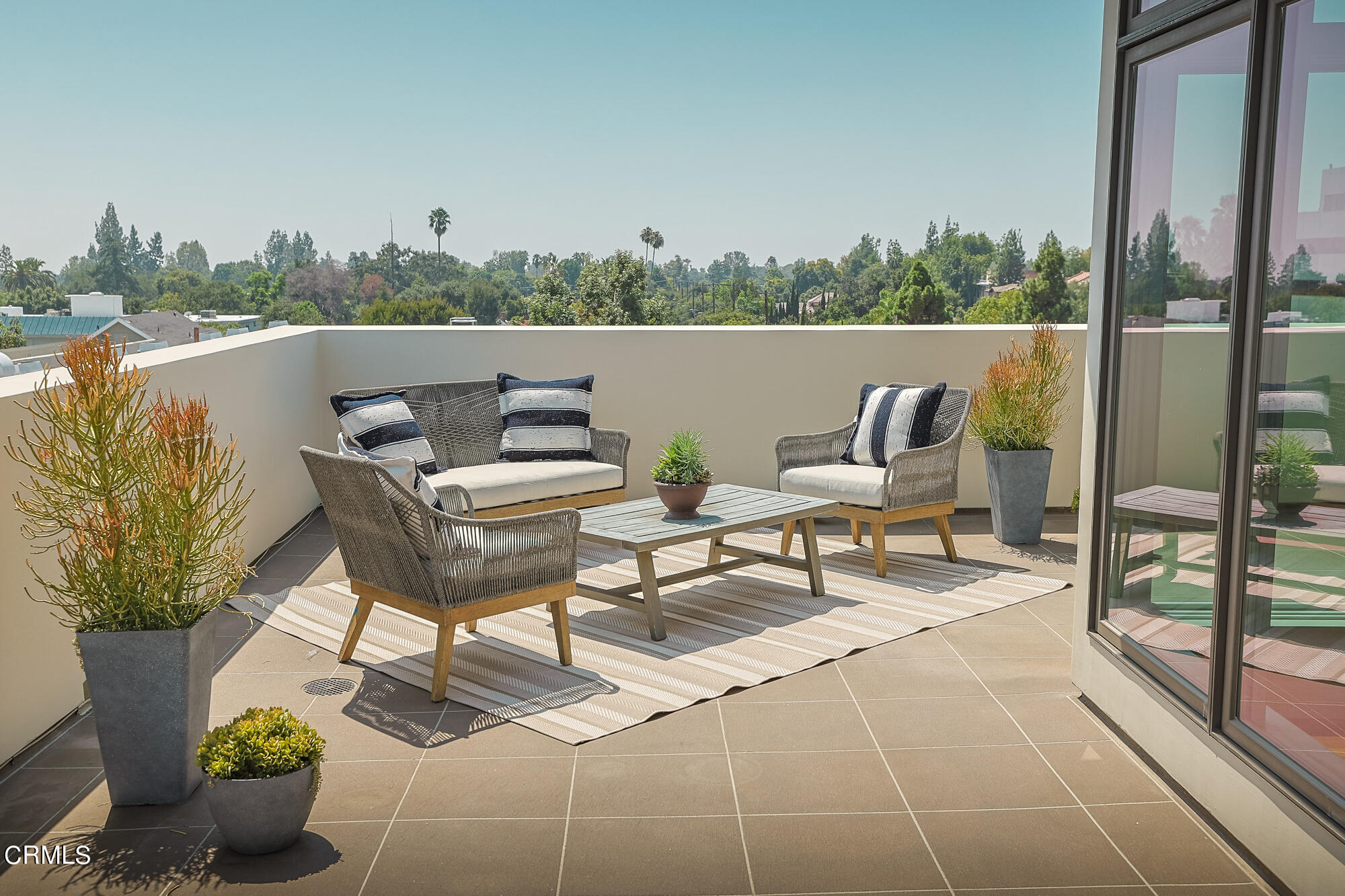 920 Granite Drive, Unit 509 Pasadena, CA 91101 - Photo 14 of 24 a terrace with outdoor seating and trees