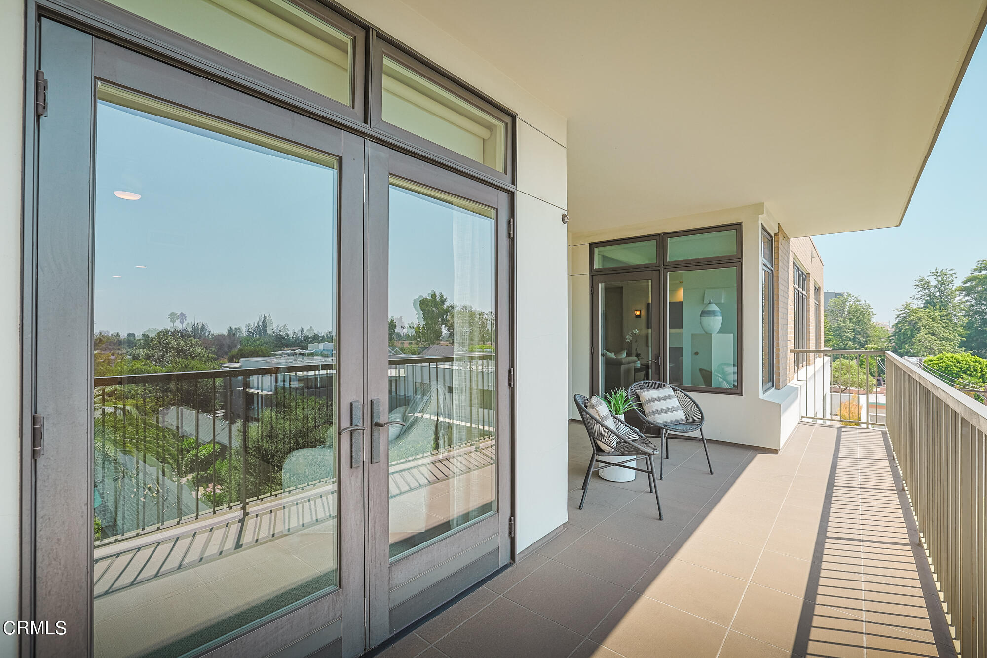 920 Granite Drive, Unit 509 Pasadena, CA 91101 - Photo 17 of 24 a view of a balcony with couch and wooden floor