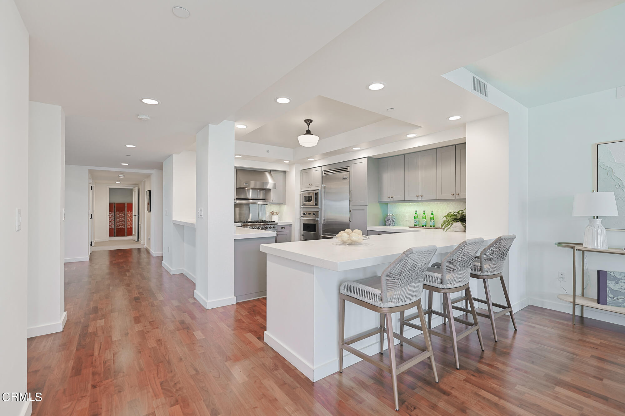 920 Granite Drive, Unit 509 Pasadena, CA 91101 - Photo 6 of 24 a kitchen with stainless steel appliances a dining table chairs stove and refrigerator