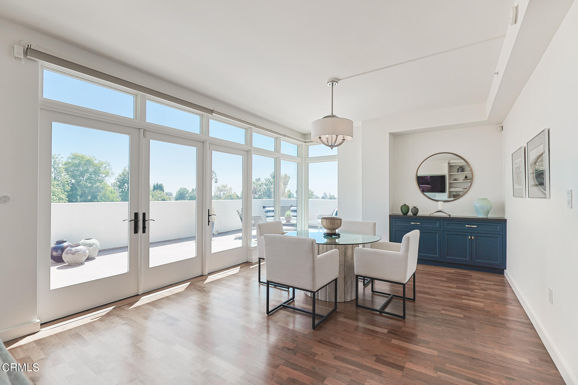 920 Granite Drive, Unit 509 Pasadena, CA 91101 - Photo 10 of 24 a dining room with wooden floor a glass table and chairs