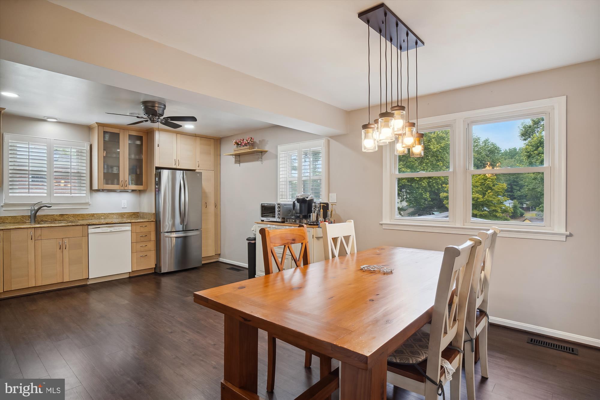 18709 Bloomfield Road Olney, MD 20832 - Photo 12 of 56 a dining room with furniture a chandelier and wooden floor