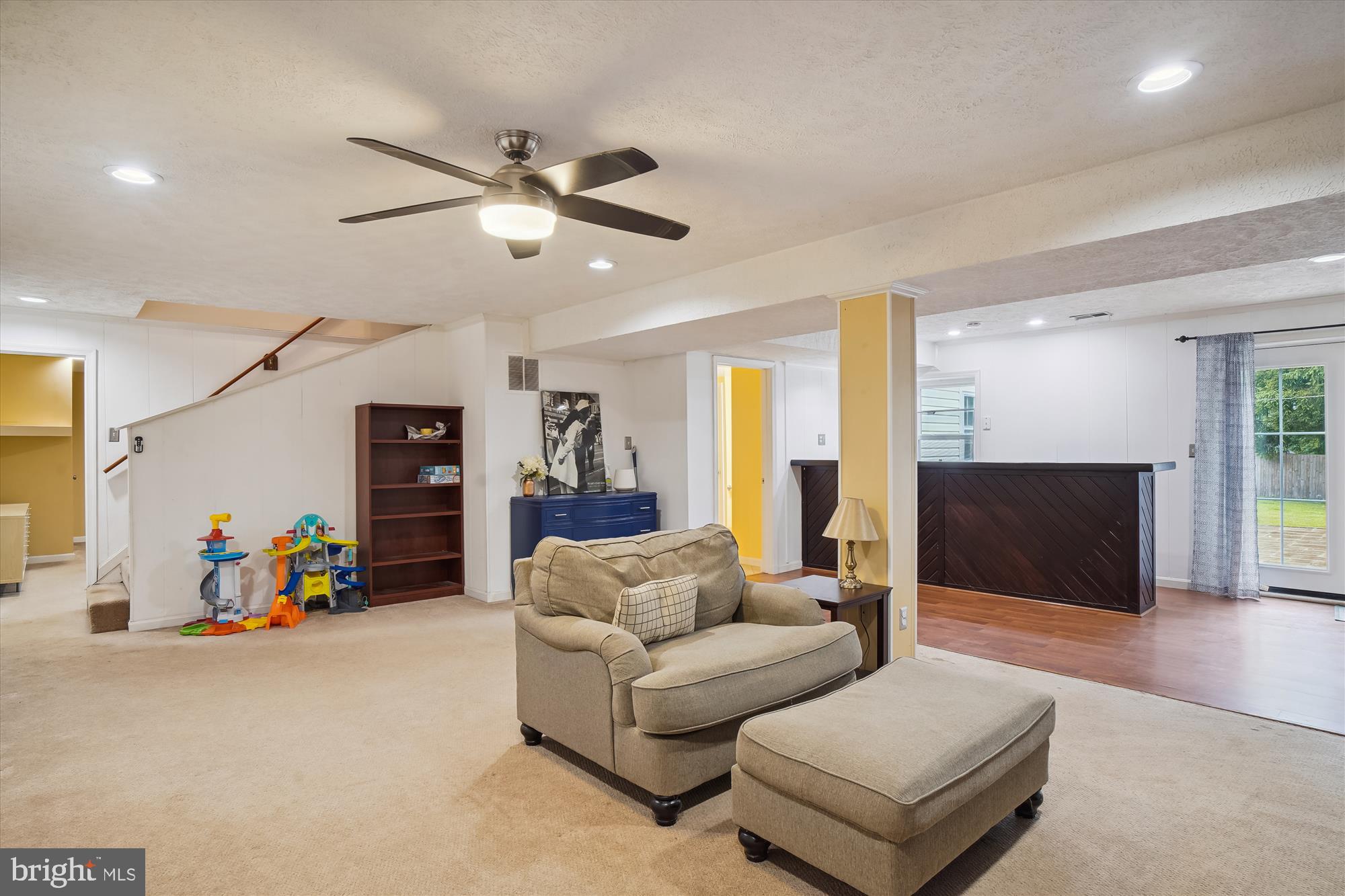 18709 Bloomfield Road Olney, MD 20832 - Photo 30 of 56 a living room with furniture and a flat screen tv