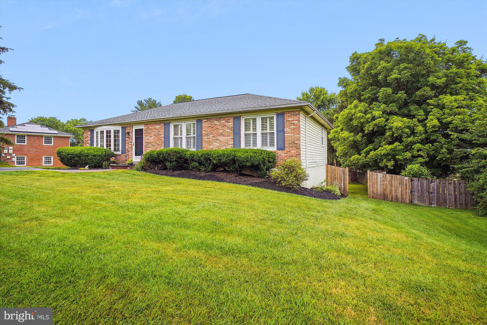 18709 Bloomfield Road Olney, MD 20832 - Photo 52 of 56 a front view of a house with yard and green space