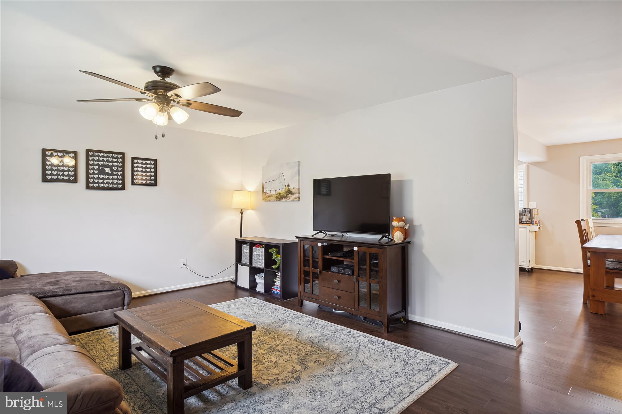 18709 Bloomfield Road Olney, MD 20832 - Photo 6 of 56 a living room with furniture and a flat screen tv
