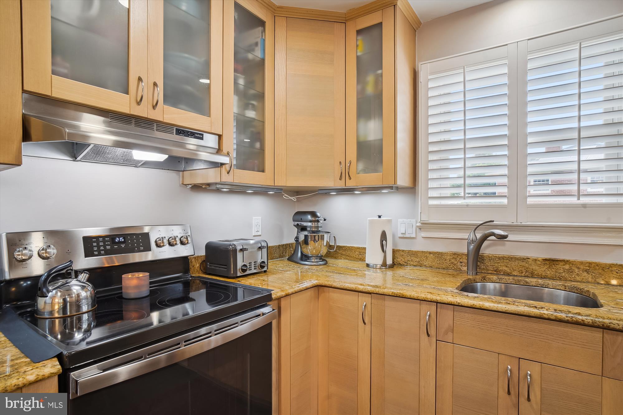 18709 Bloomfield Road Olney, MD 20832 - Photo 8 of 56 a kitchen with sink a window and cabinets