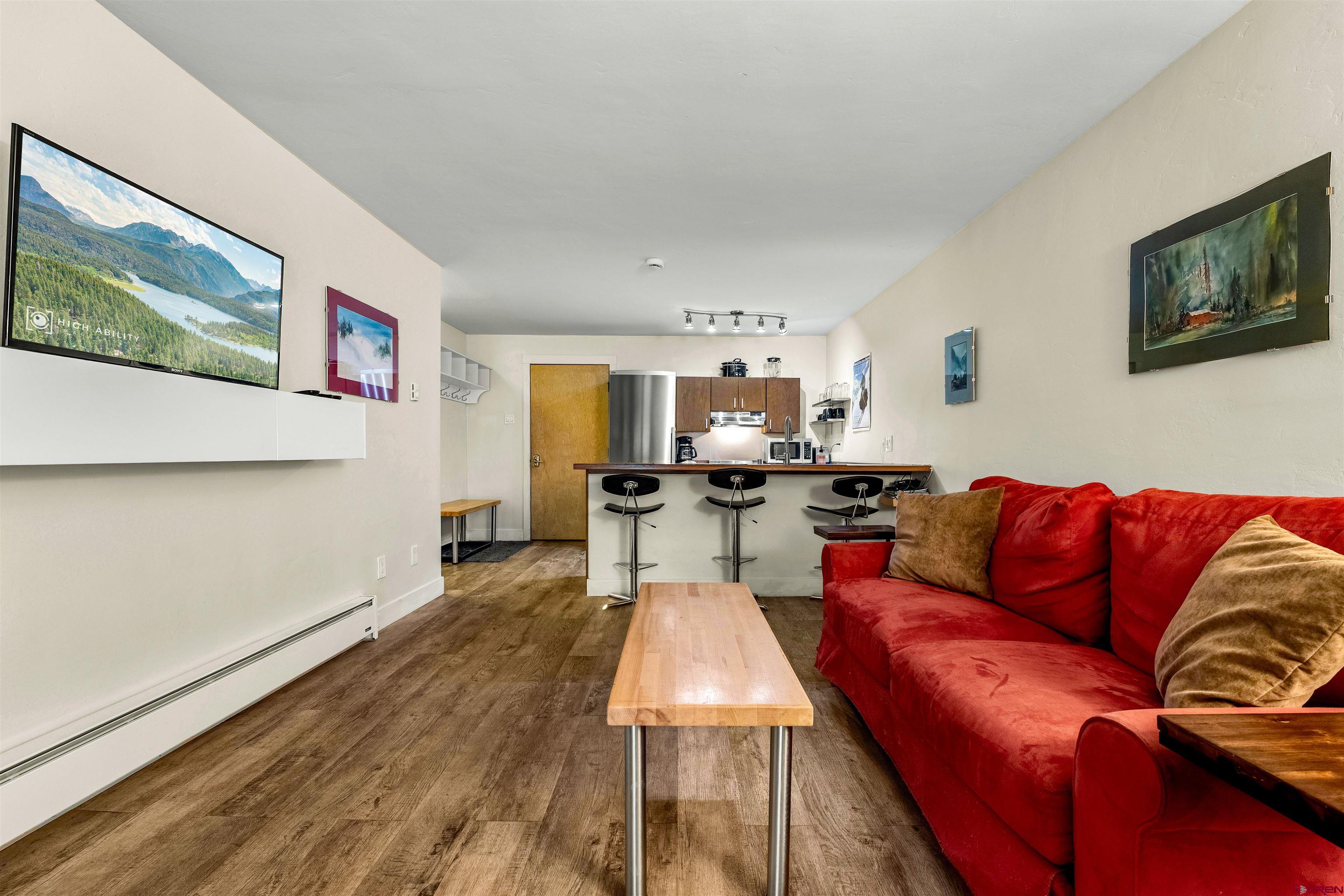 455 Sheol Street, Unit 209 Durango, CO 81301 - Photo 12 of 30 a living room with furniture and a flat screen tv
