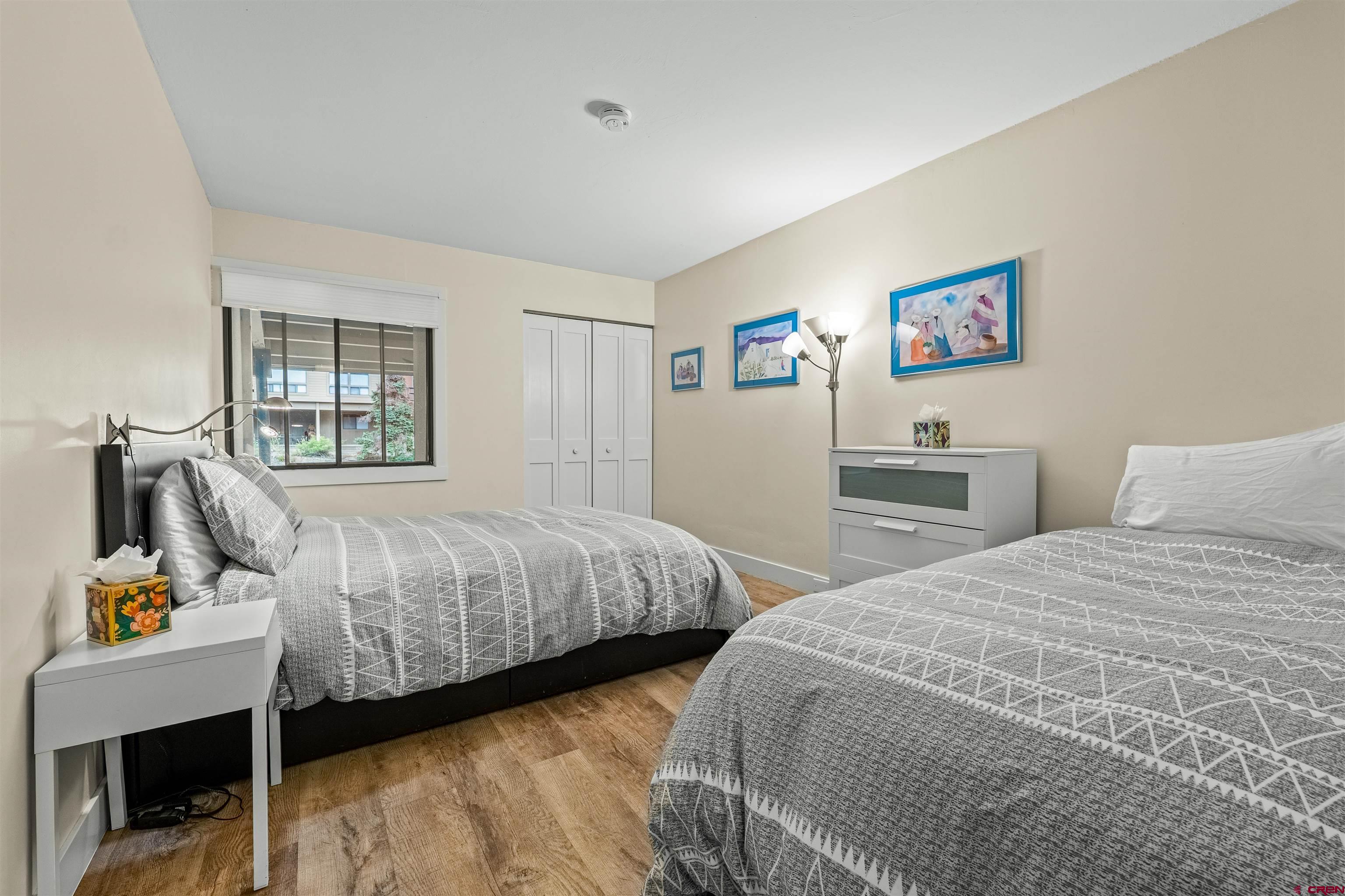 455 Sheol Street, Unit 209 Durango, CO 81301 - Photo 15 of 30 a bedroom with two beds and a window