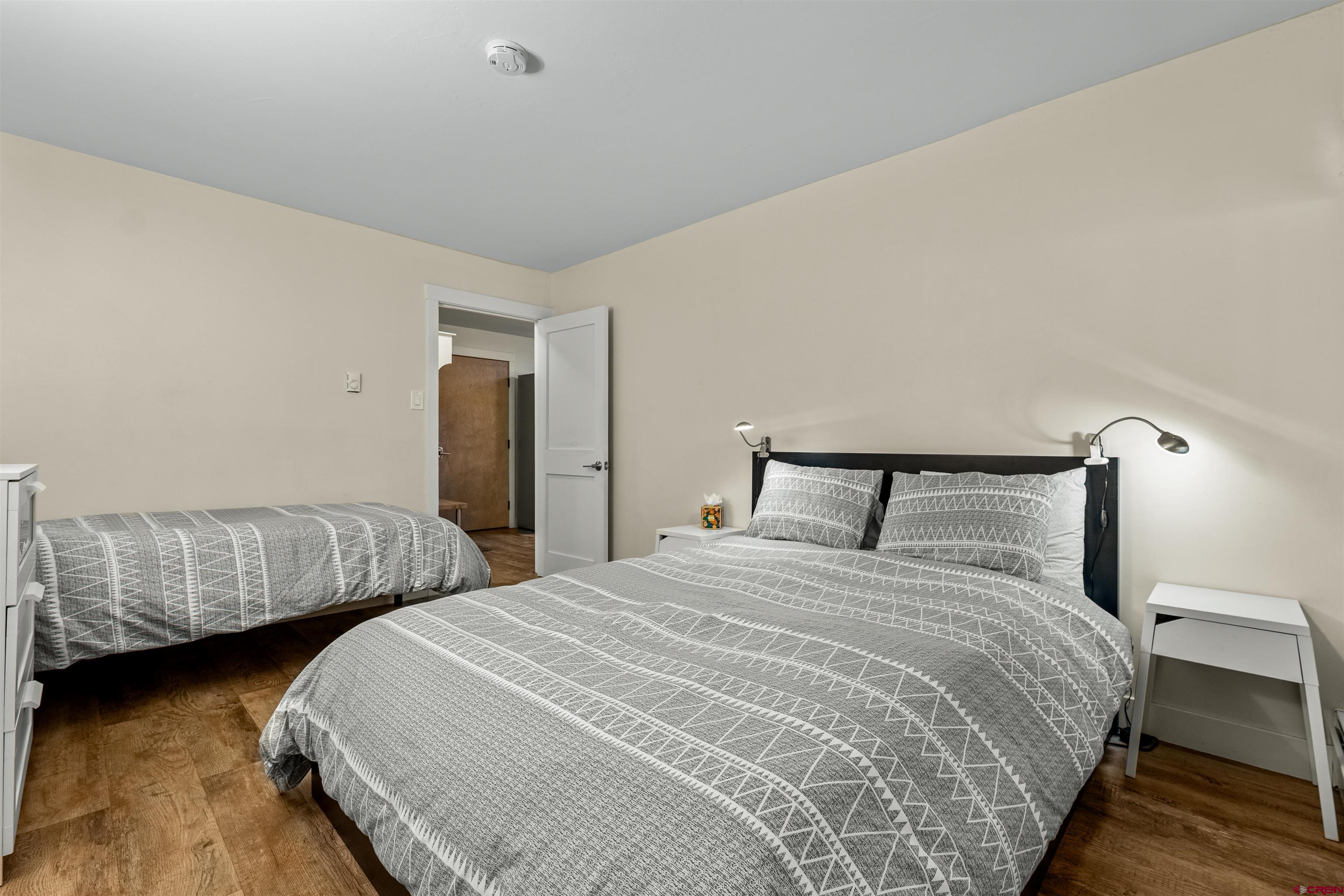 455 Sheol Street, Unit 209 Durango, CO 81301 - Photo 16 of 30 a bedroom with two beds and lamp