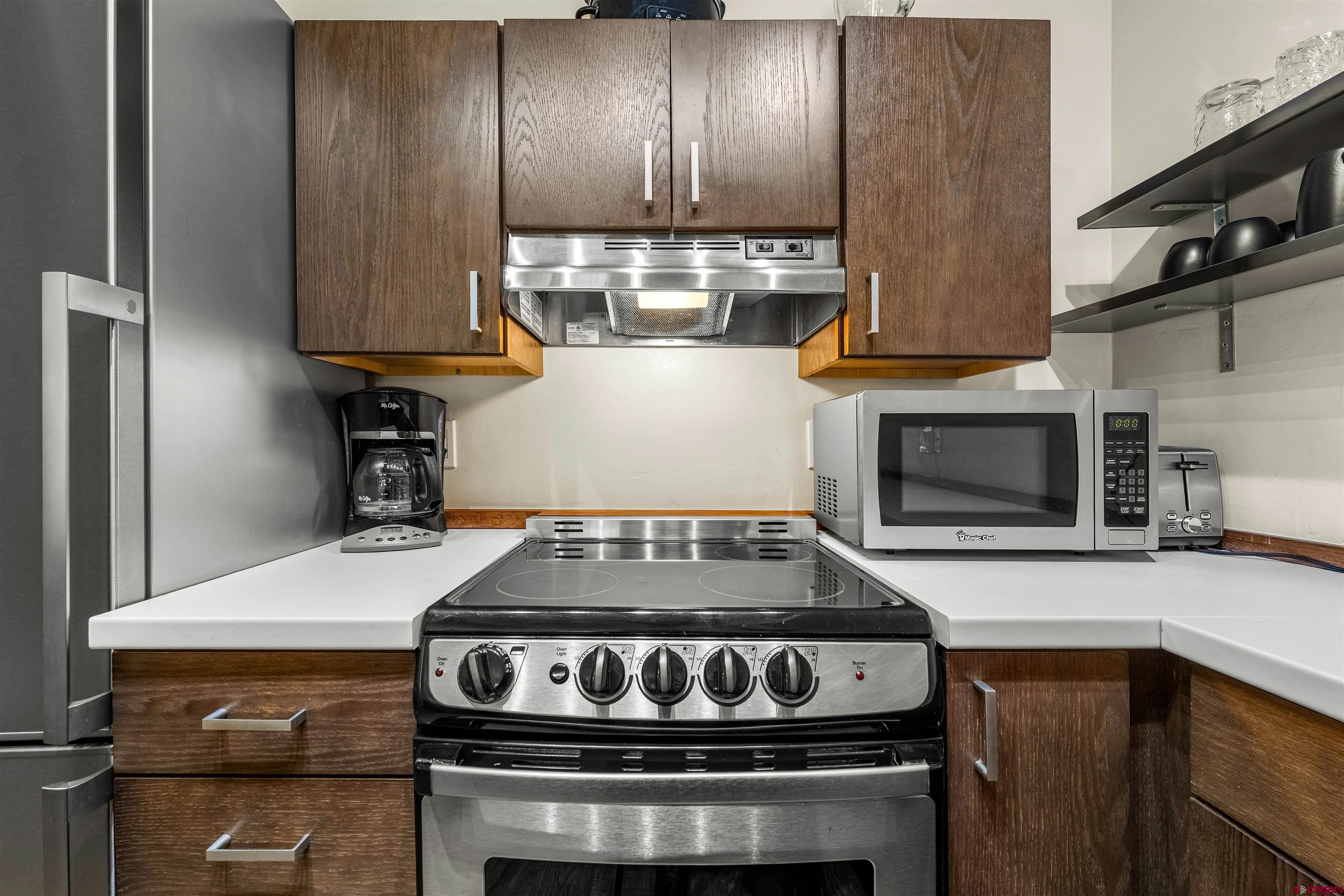 455 Sheol Street, Unit 209 Durango, CO 81301 - Photo 7 of 30 a stove top oven sitting inside of a kitchen