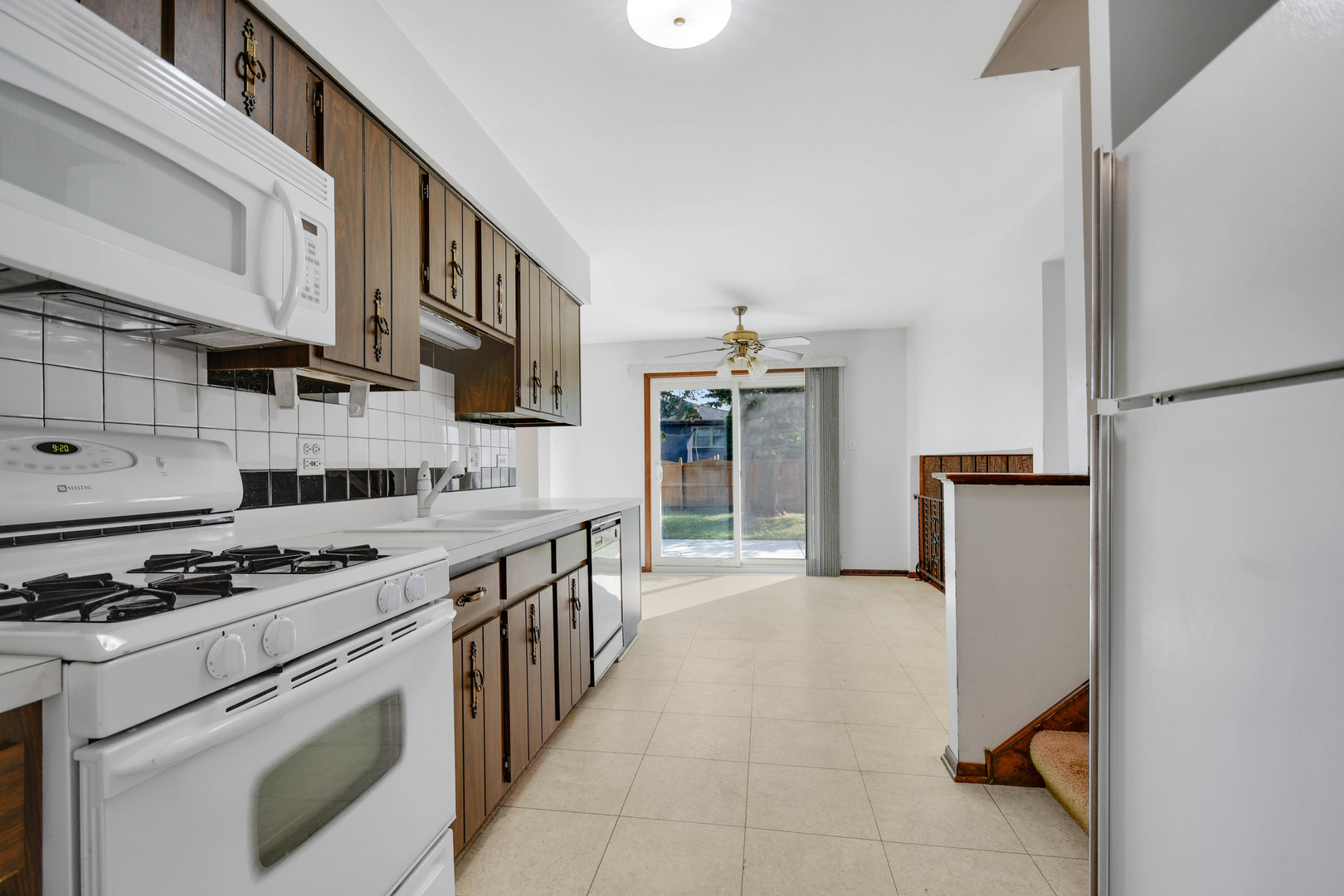 11201 Deerpath Lane Palos Hills, IL 60465 - Photo 7 of 25 a kitchen with stainless steel appliances a stove and a refrigerator