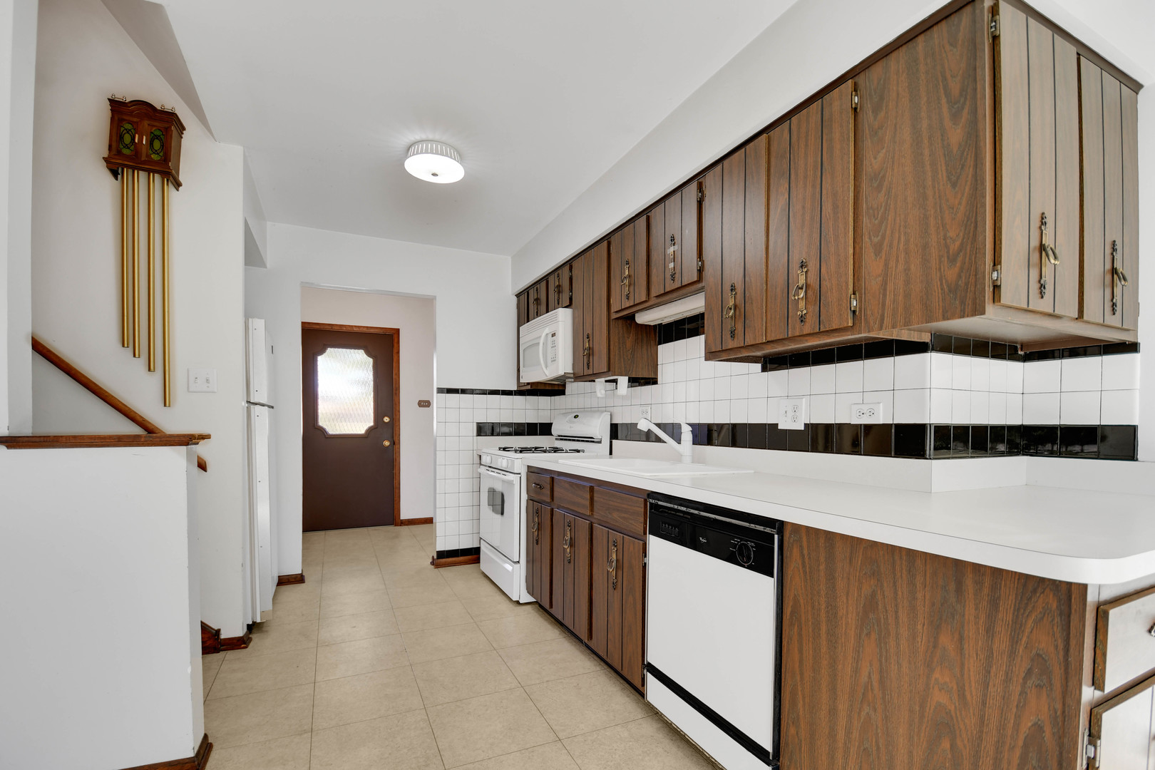 11201 Deerpath Lane Palos Hills, IL 60465 - Photo 10 of 25 a kitchen with stainless steel appliances a stove a sink and a refrigerator