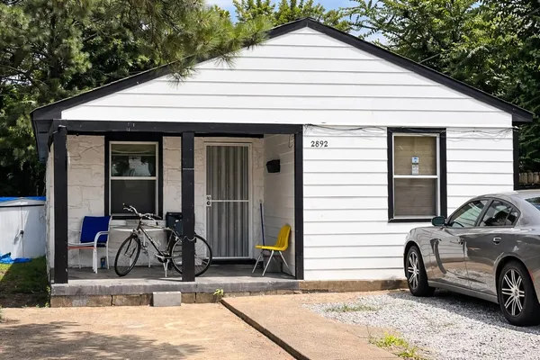 a view of a car park in front of house