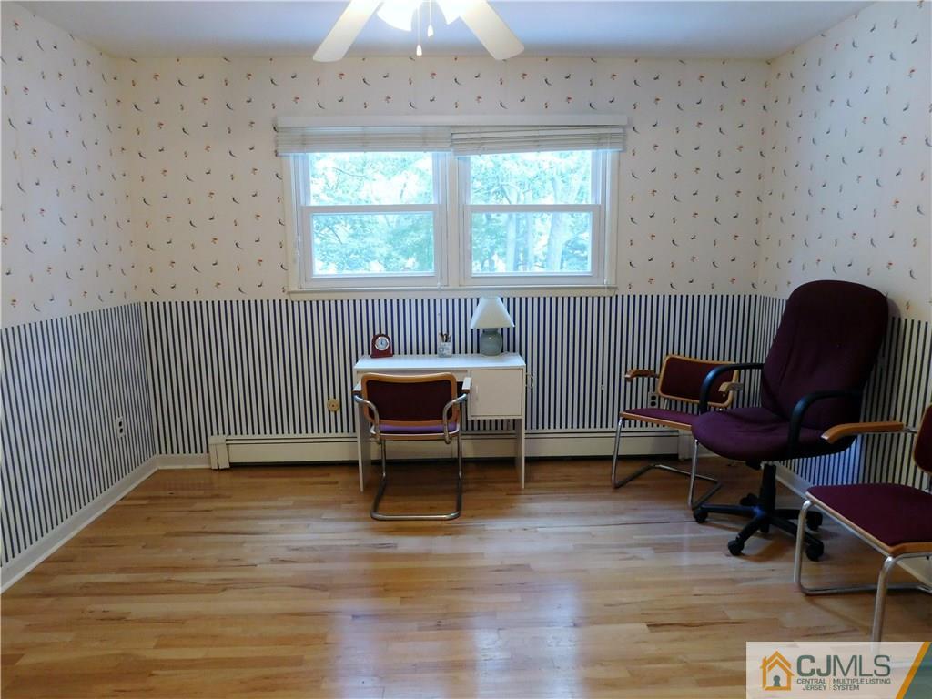 18 Lynnwood Road Edison, NJ 08820 - Photo 22 of 25 a view of a workspace with furniture and a window