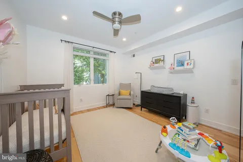 a bedroom with furniture and a window