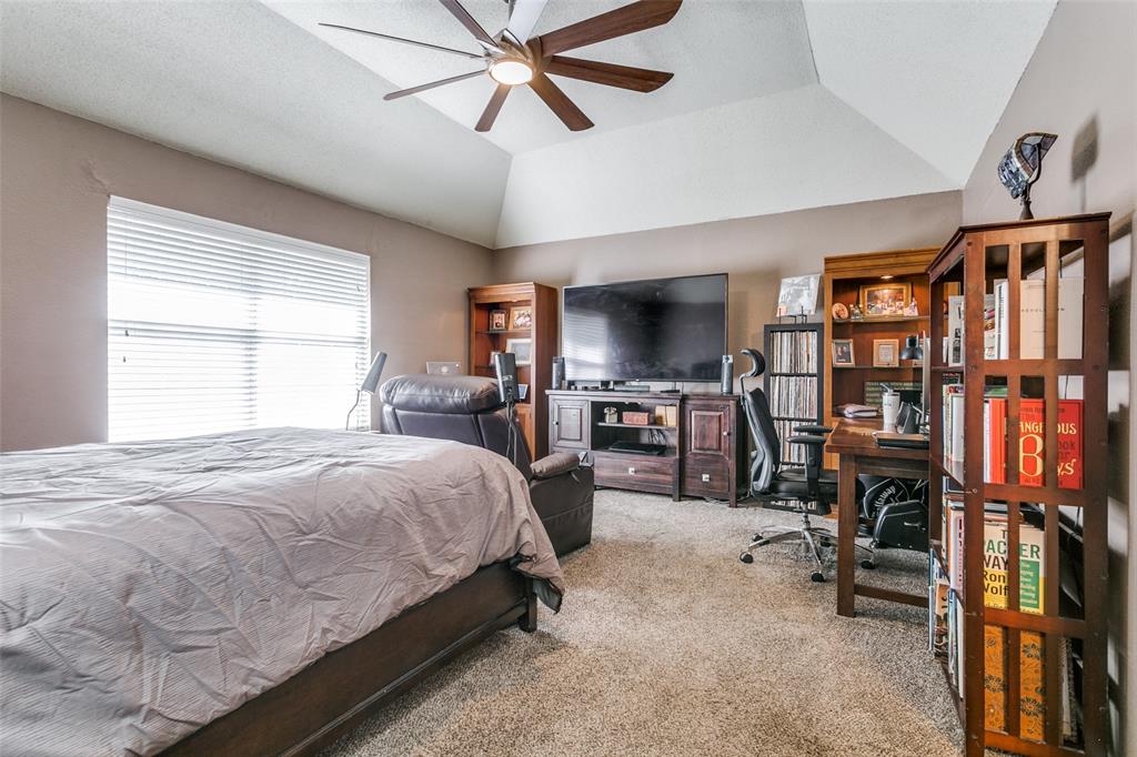 2133 Rim Rock Drive Keller, TX 76248 - Photo 22 of 37 Bedroom with carpet flooring, an office area, vaulted ceiling, and ceiling fan