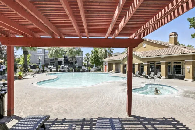 a view of a patio with a table and chairs