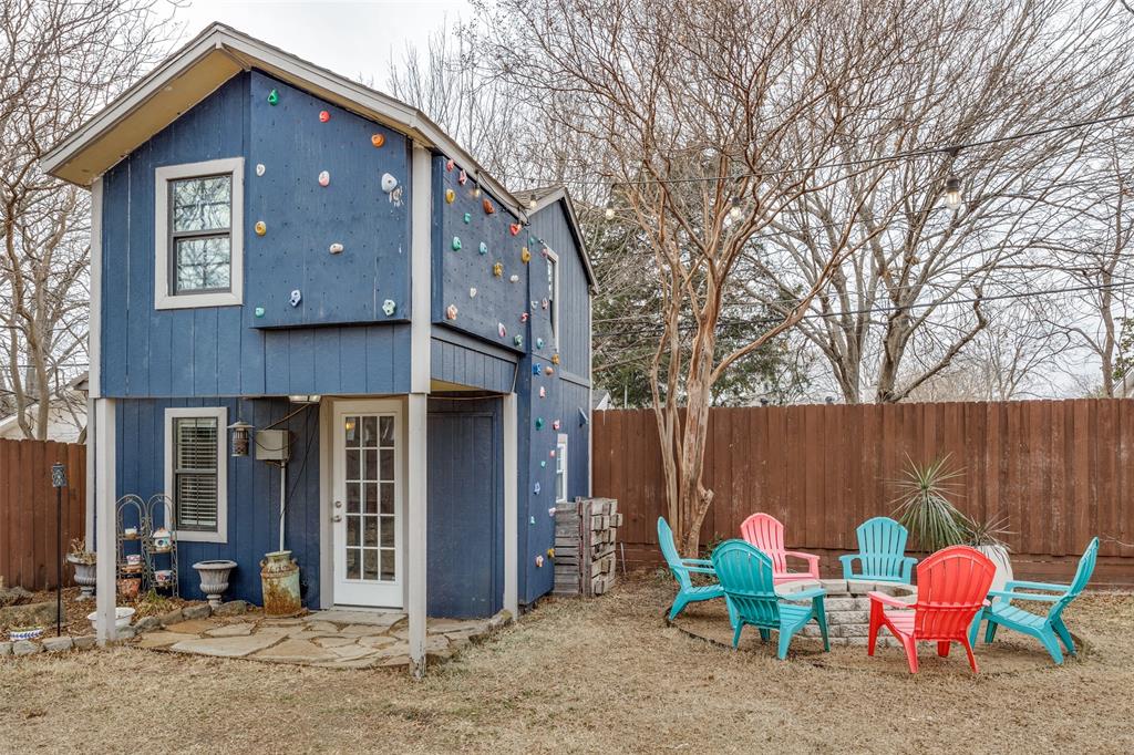 8535 Strathmore Drive Dallas, TX 75238 - Photo 2 of 23 a backyard of a house with table and chairs
