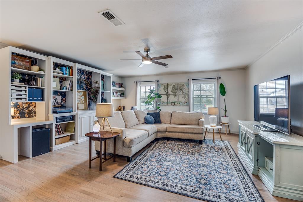 8535 Strathmore Drive Dallas, TX 75238 - Photo 3 of 23 a living room with furniture and a rug