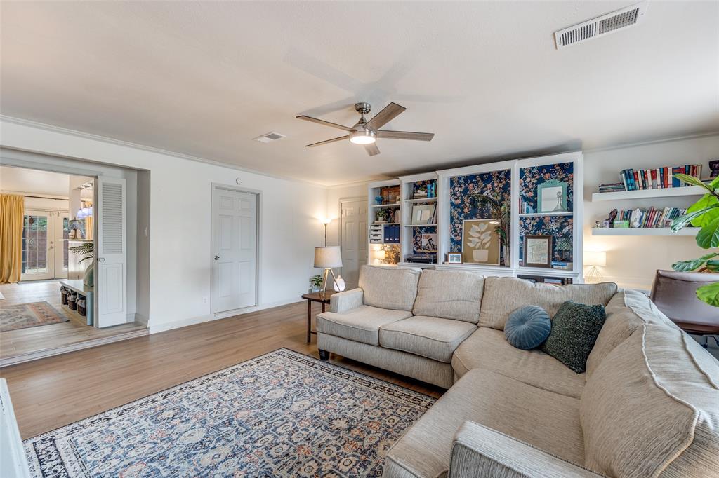 8535 Strathmore Drive Dallas, TX 75238 - Photo 6 of 23 a living room with furniture and window