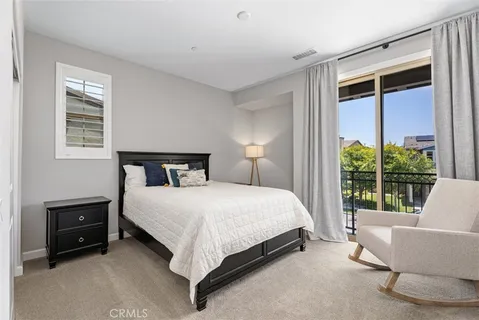 a bedroom with a bed and a couch