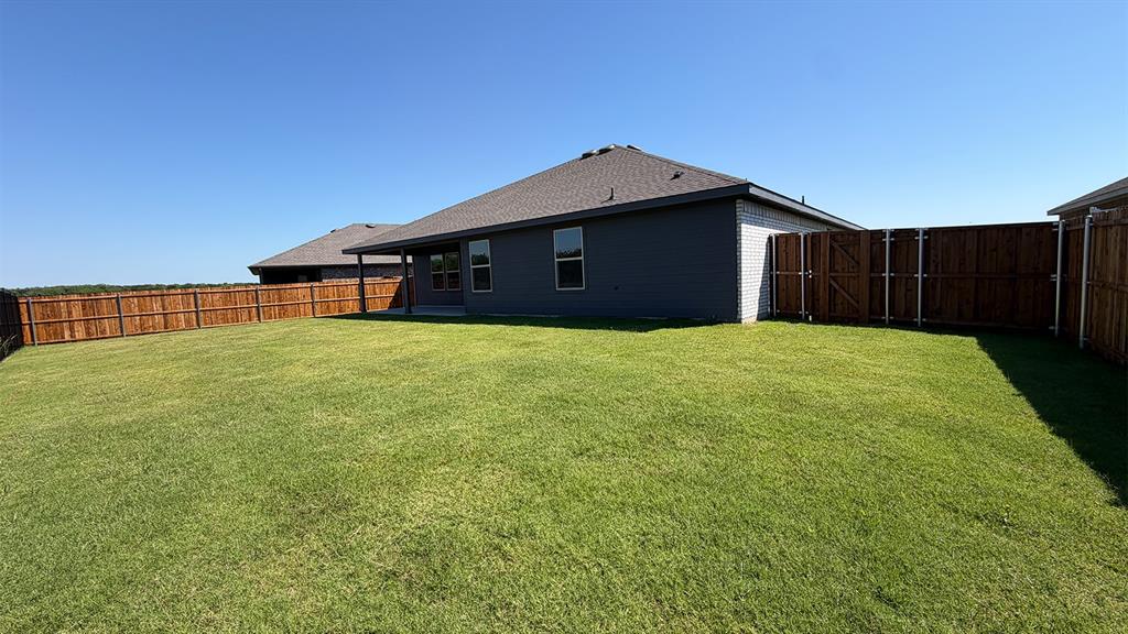1913 Reveille Way Terrell, TX 75160 - Photo 25 of 35 Expansive grassy backyard featuring a full privacy fence