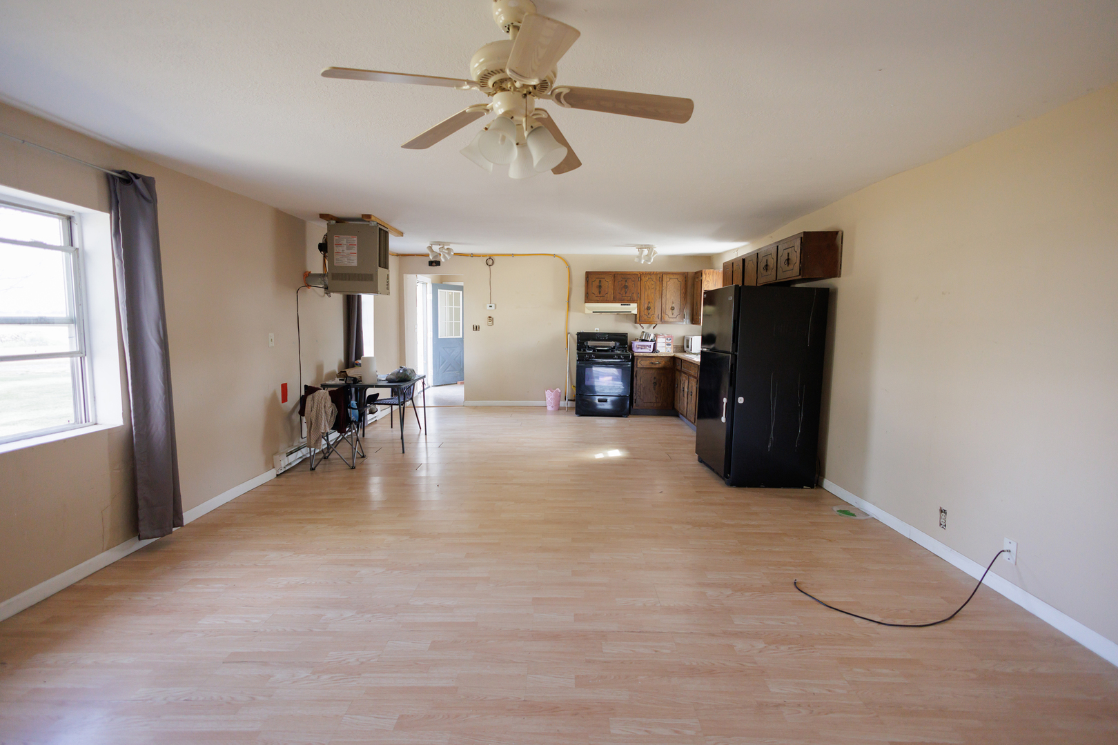 2060 West 5000S Road Chebanse, IL 60922 - Photo 12 of 54 a view of livingroom with furniture ceiling fan and window