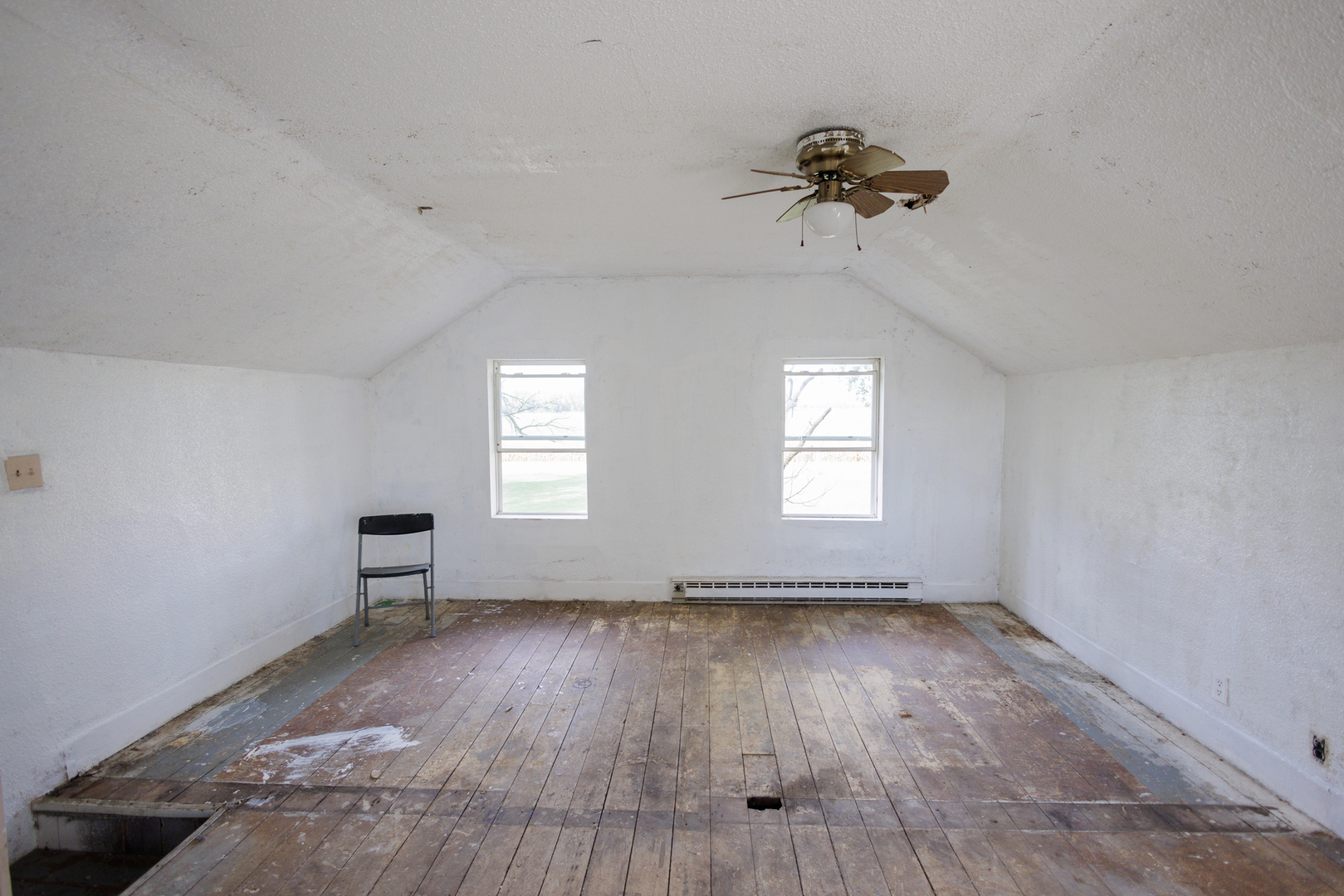 2060 West 5000S Road Chebanse, IL 60922 - Photo 22 of 54 an empty room with wooden floor chandelier and windows