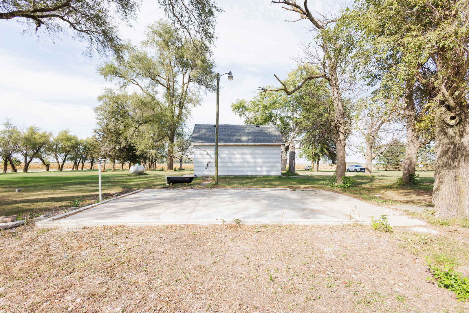 2060 West 5000S Road Chebanse, IL 60922 - Photo 30 of 54 a view of a house with a yard and large trees