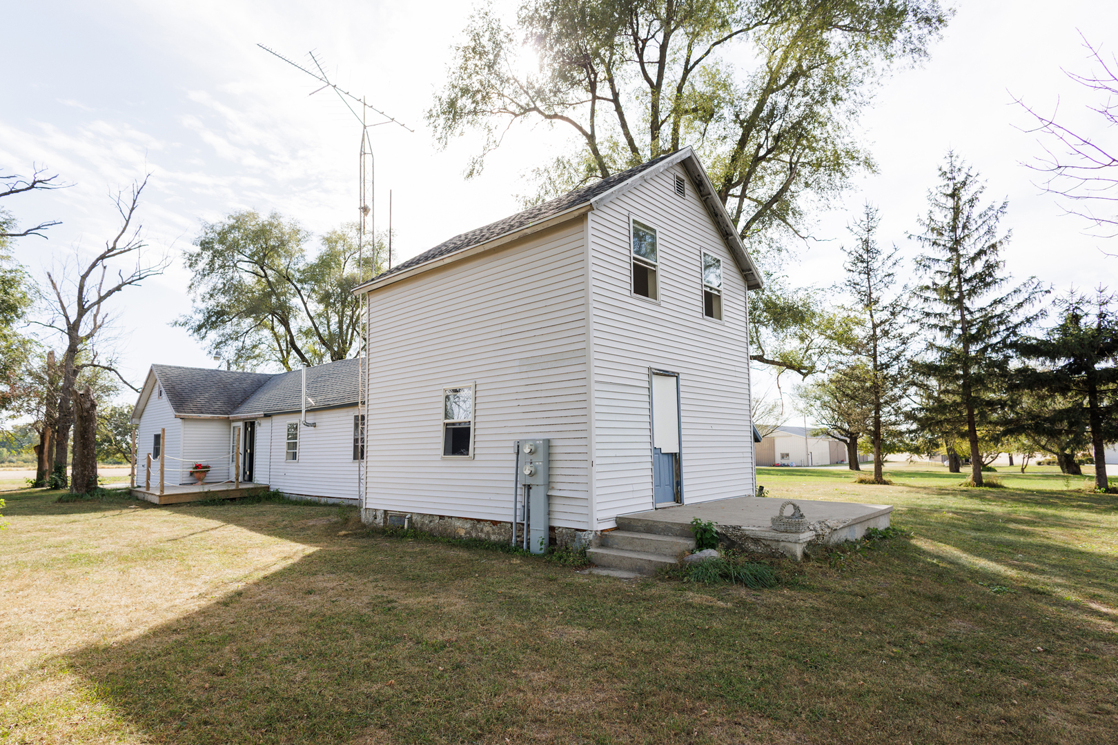 2060 West 5000S Road Chebanse, IL 60922 - Photo 32 of 54 a view of a white house with a yard