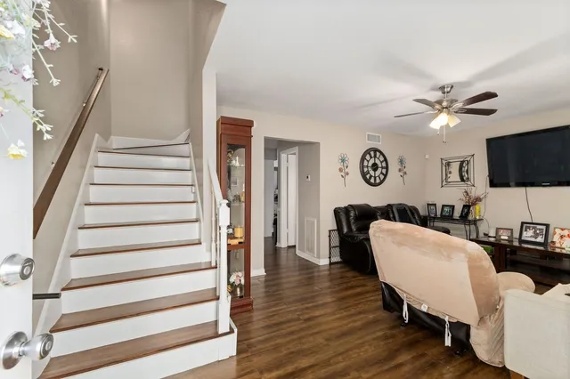 a view of a livingroom with furniture and a workspace