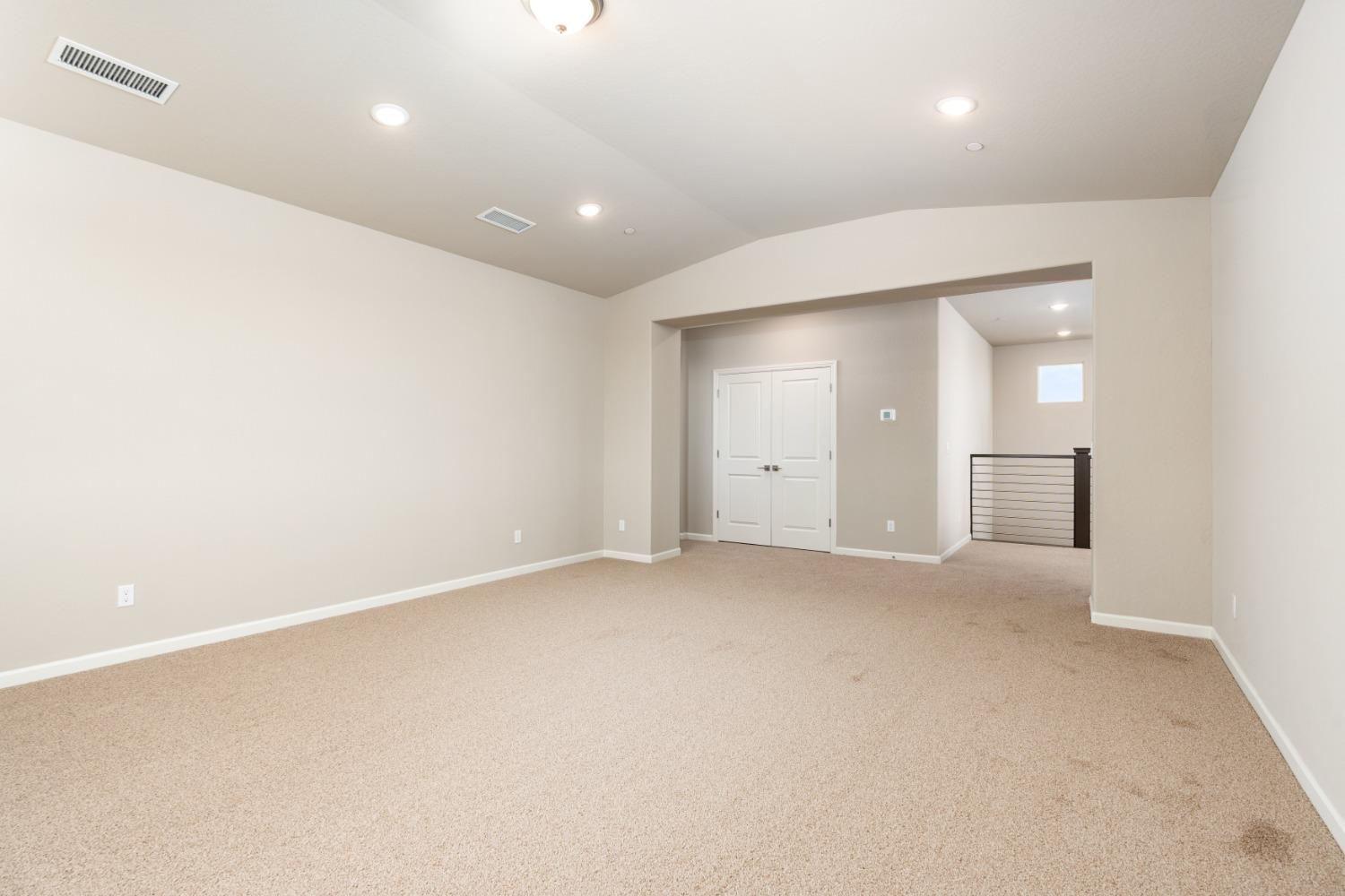 952 Pinnacle Drive Madera, CA 93636 - Photo 26 of 32 an empty room with a fireplace and windows